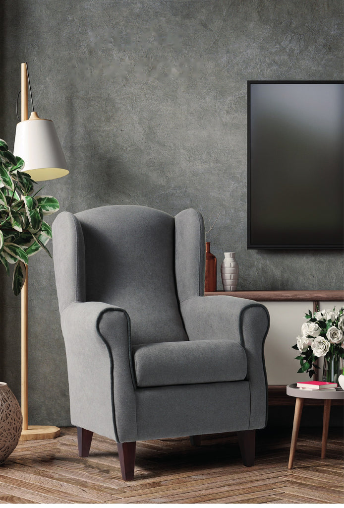 Sillón orejero Low Cost gris con vivo contrastado en un salón